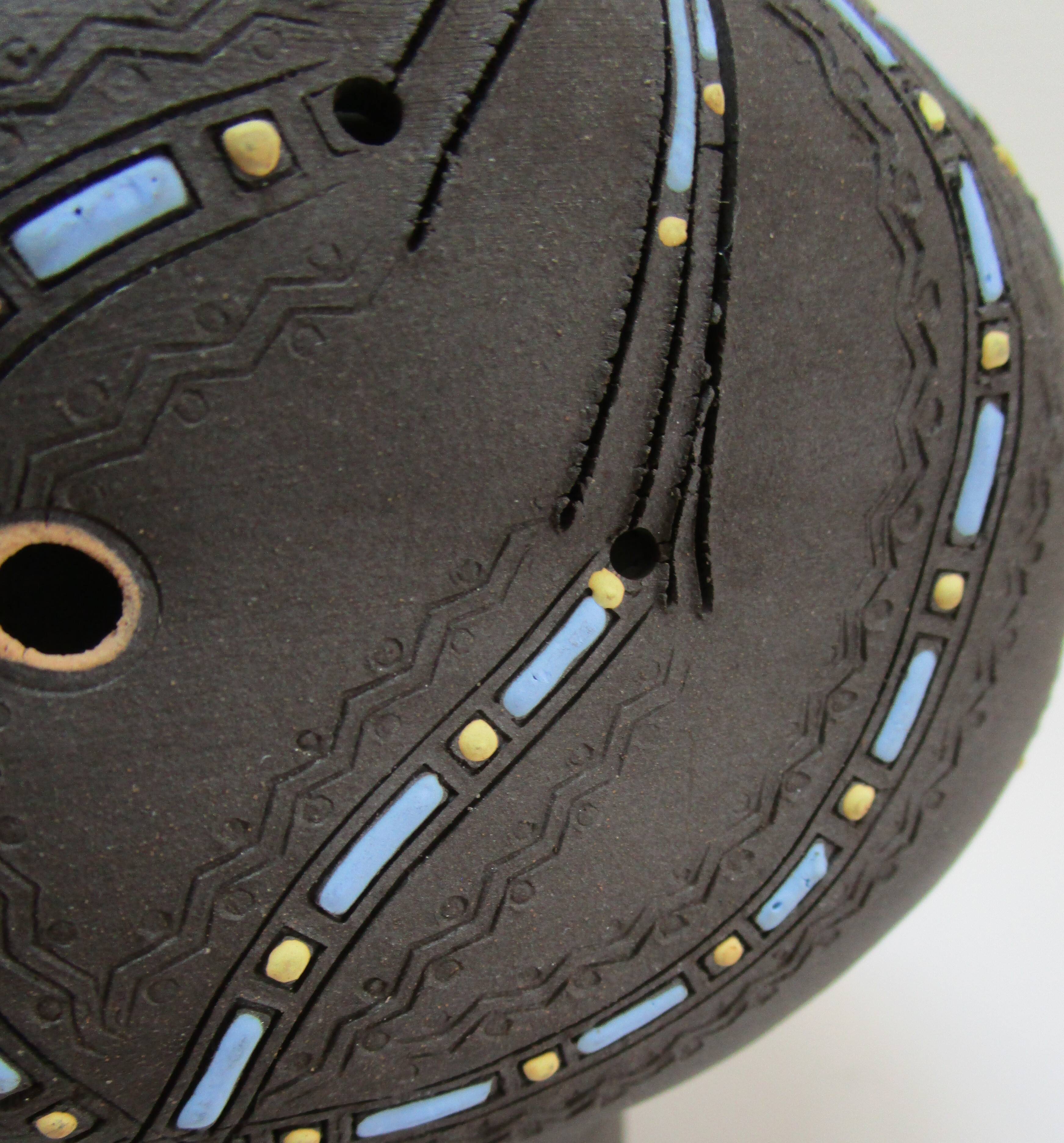 Anthropomorphic candle holder, scarified ceramic, stamped design