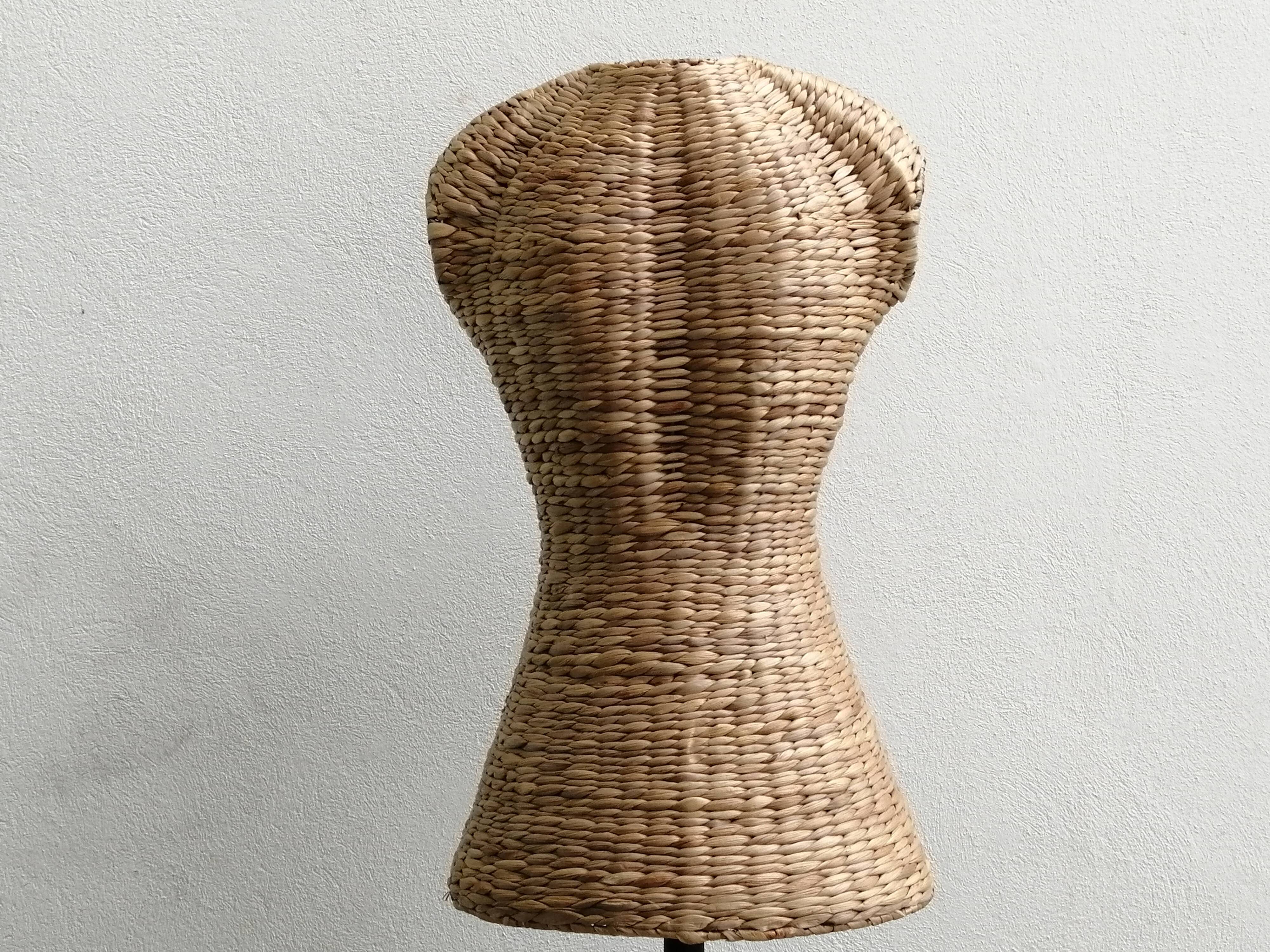 Model on a wicker stand.
