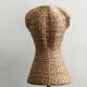 Model on a wicker stand.