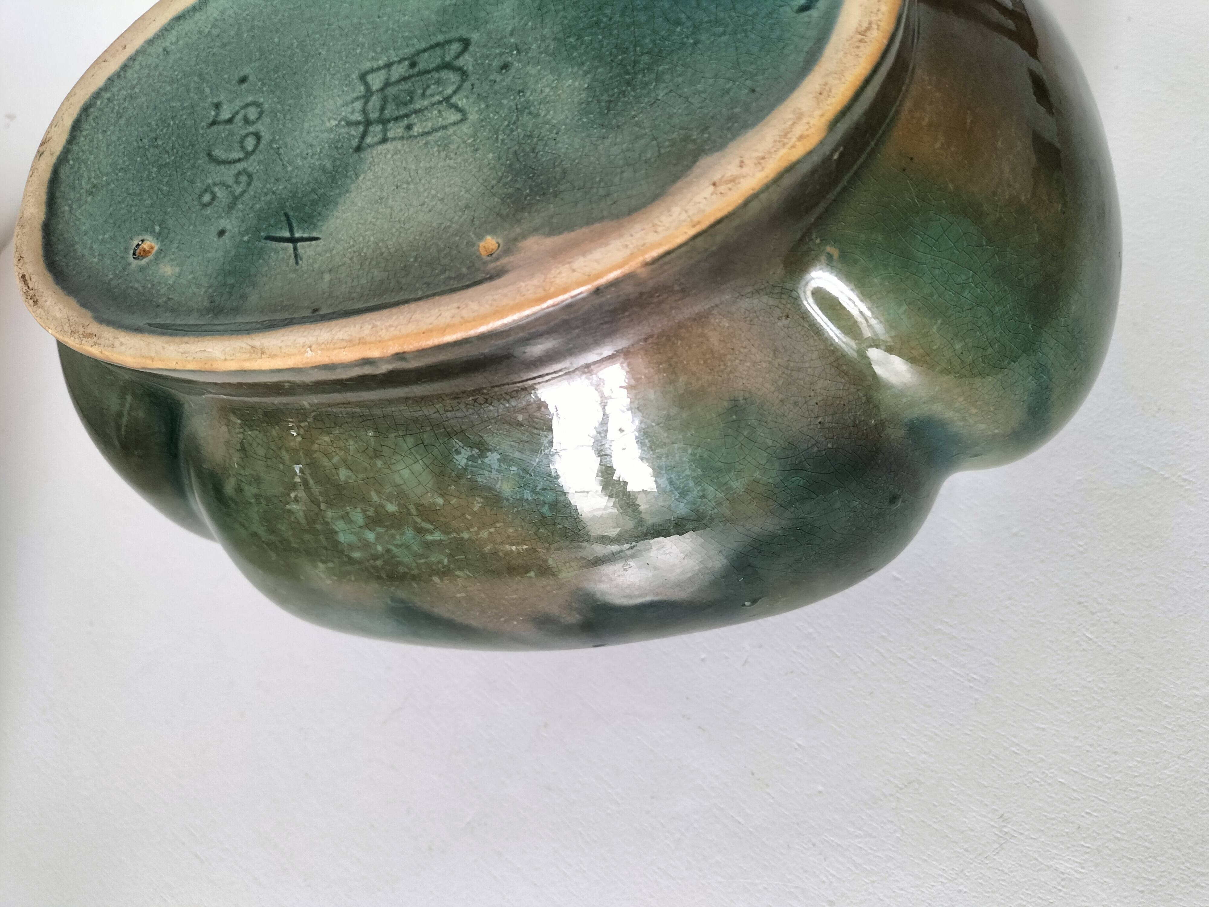 Art Deco flared cache-pot in turquoise glazed earthenware.