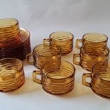 Set of 8 cups and amber glass under cups
