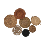 Wall composition of seven baskets and wicker trays