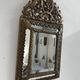 Small mirror with brass parcloses in repoussé style Louis XIV, late 19th century.