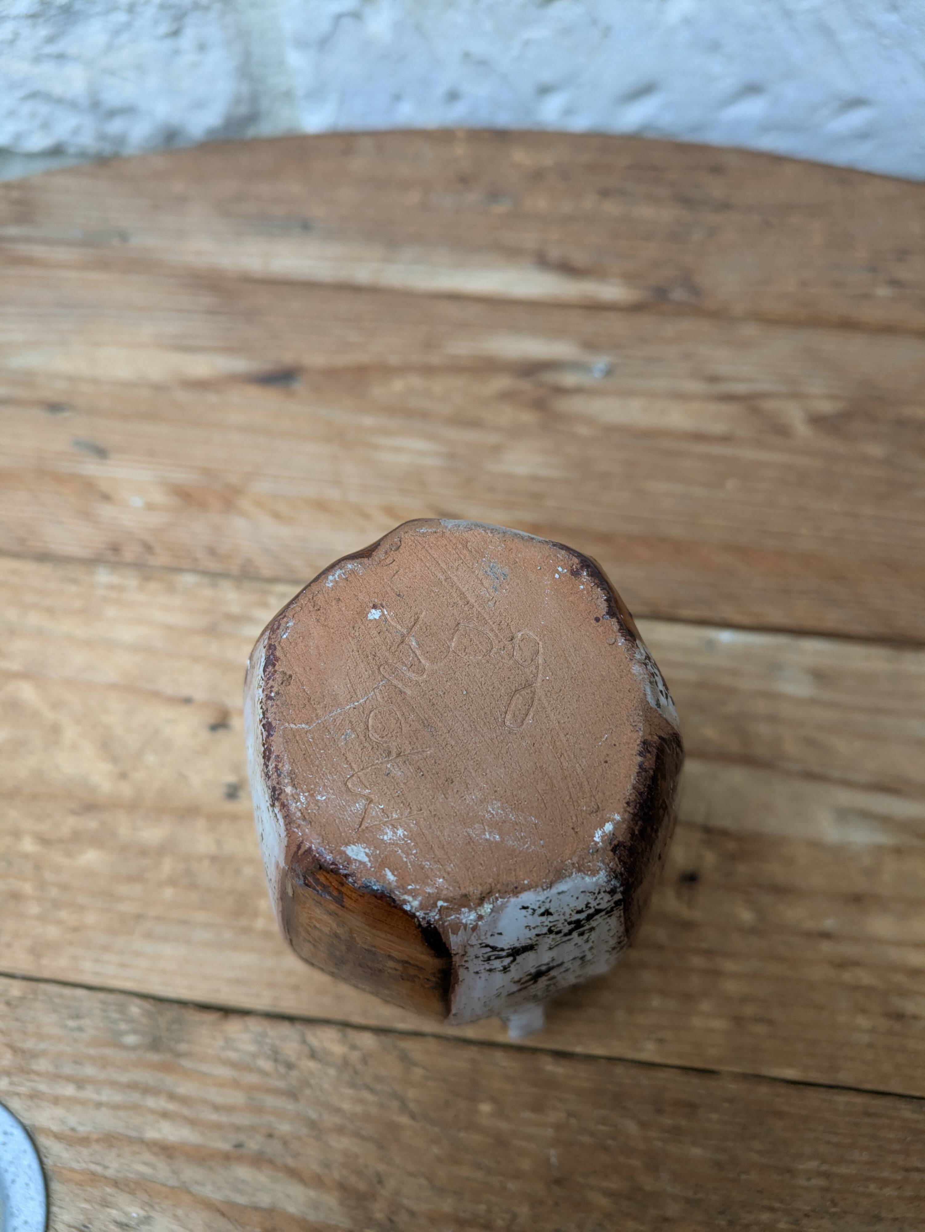 Old small pitcher in glazed terracotta