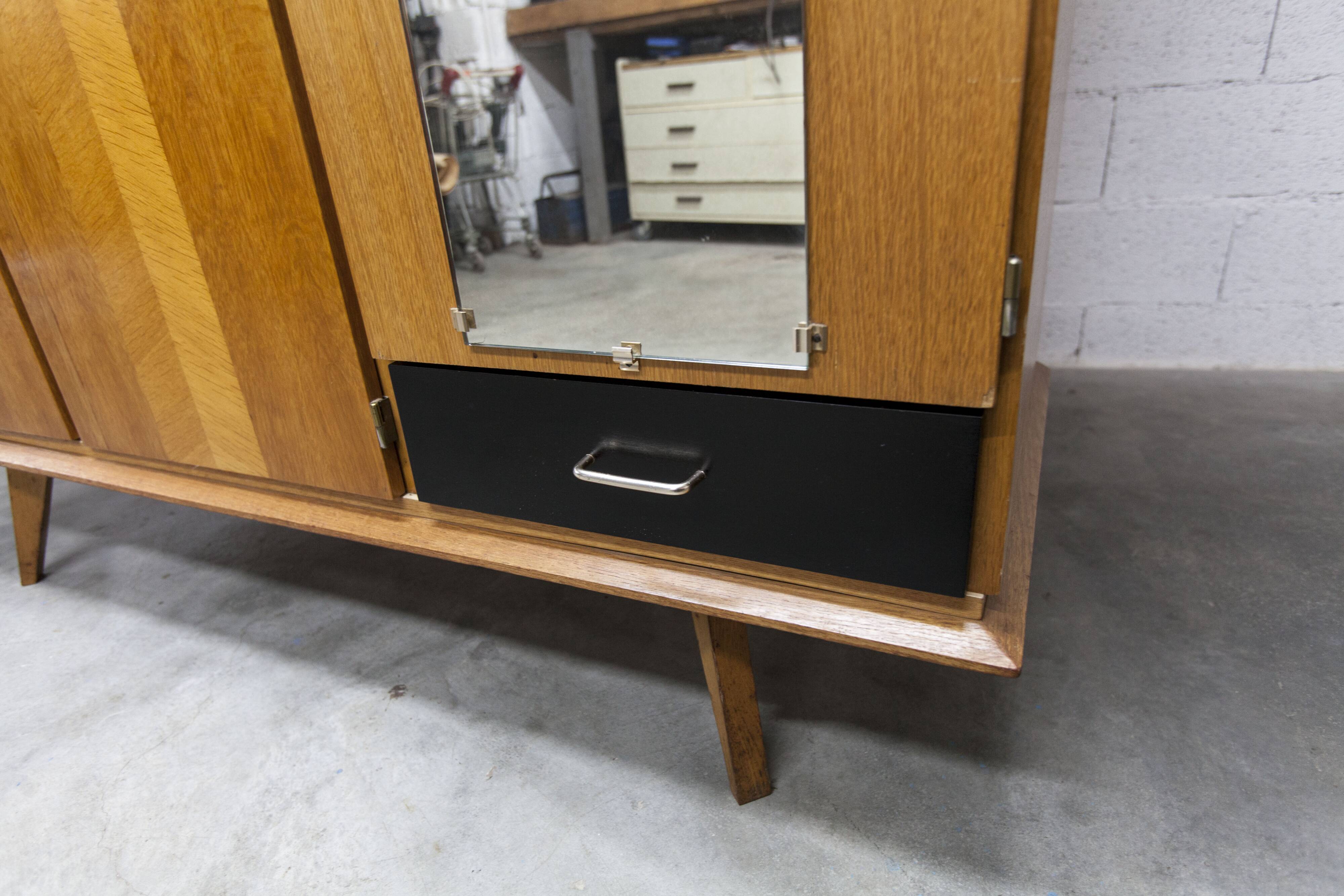 French wardrobe with tapered legs, 3 doors, 1 mirror (27*130), and 1 drawer.
