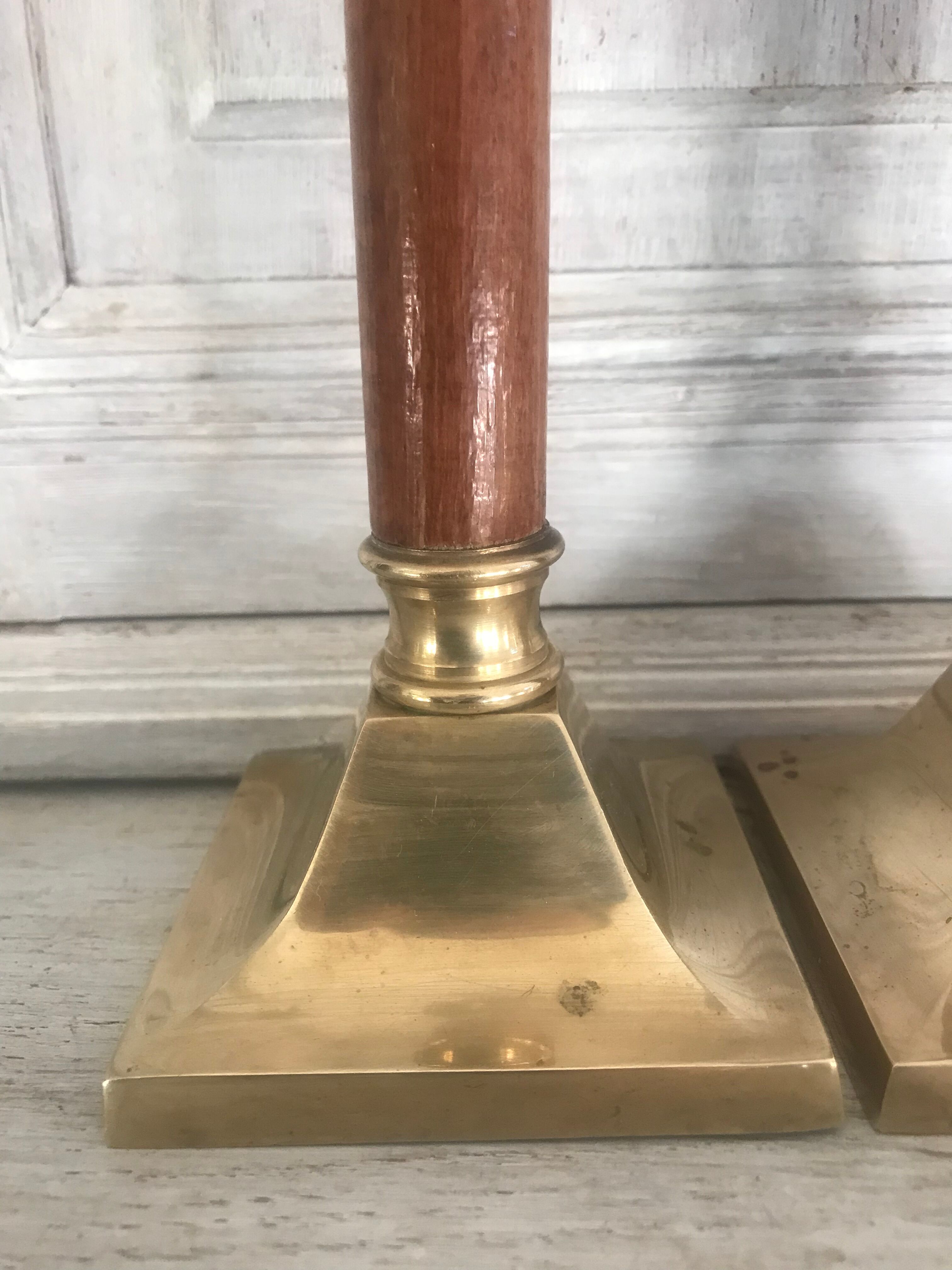 Pair of wood and brass candle holders