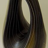 Earthenware vase decorated with yellow lines on a black and yellow background