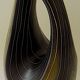 Earthenware vase decorated with yellow lines on a black and yellow background
