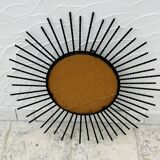 Vintage black and gold metal sun mirror from the 1960s.
