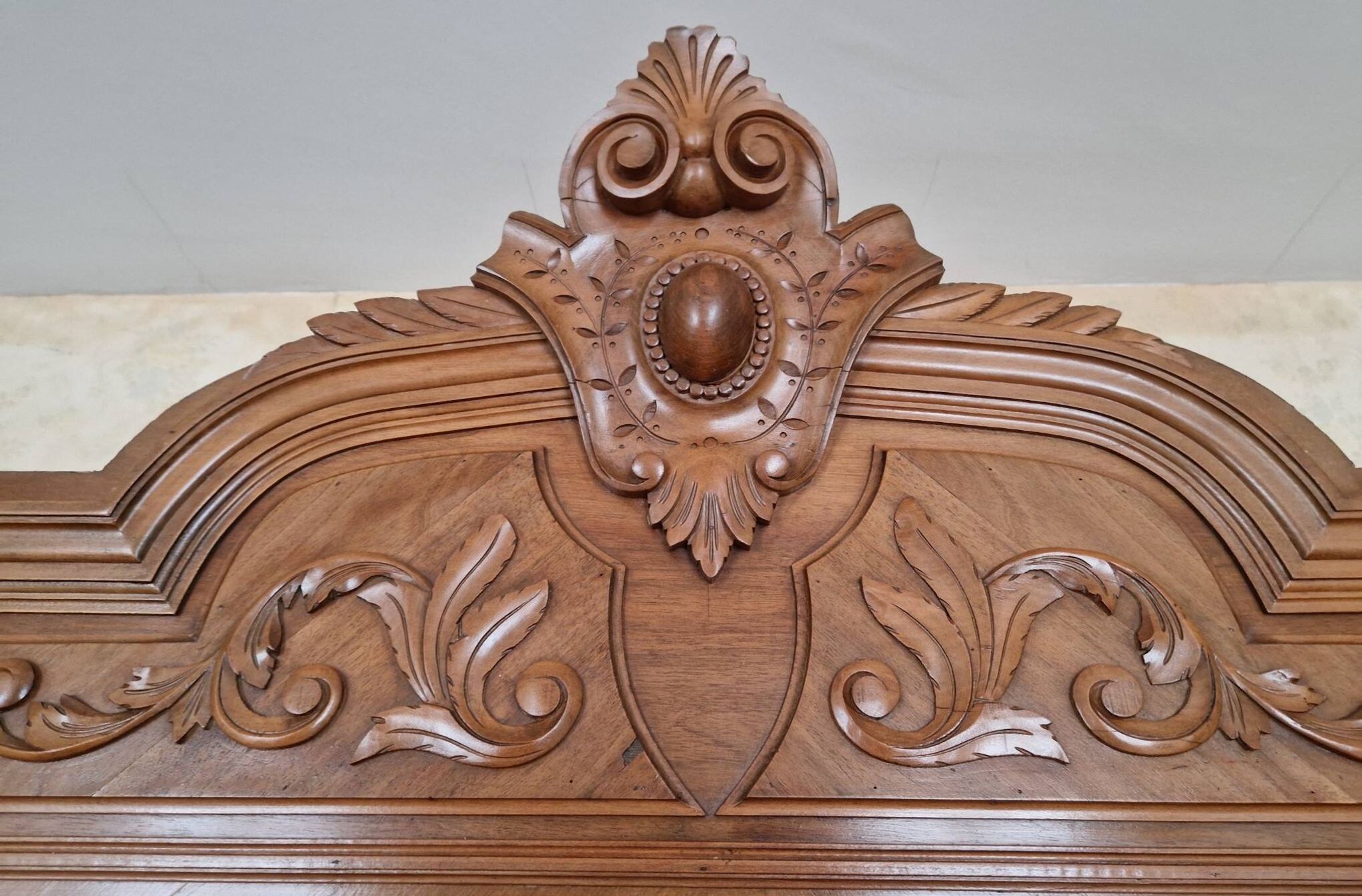 Large antique wardrobe in the Henri II style made of oak and walnut with bevelled mirrors.