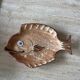 Decorative ceramic plate in the shape of a fish from the 1970s.