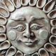 Anthropomorphic sun wall sculpture in patinated terracotta, vintage Italian craftsmanship.
