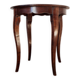 Vintage solid wood side table with curved legs.