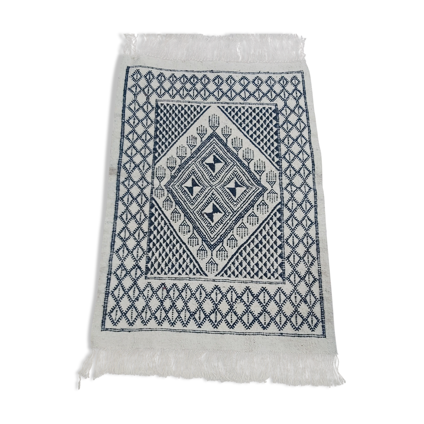 Traditional white and blue hand-woven wool carpet