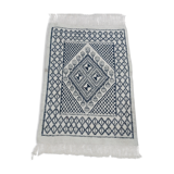 Traditional white and blue hand-woven wool carpet