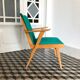 Fauteuil vintage bois et skaï vert