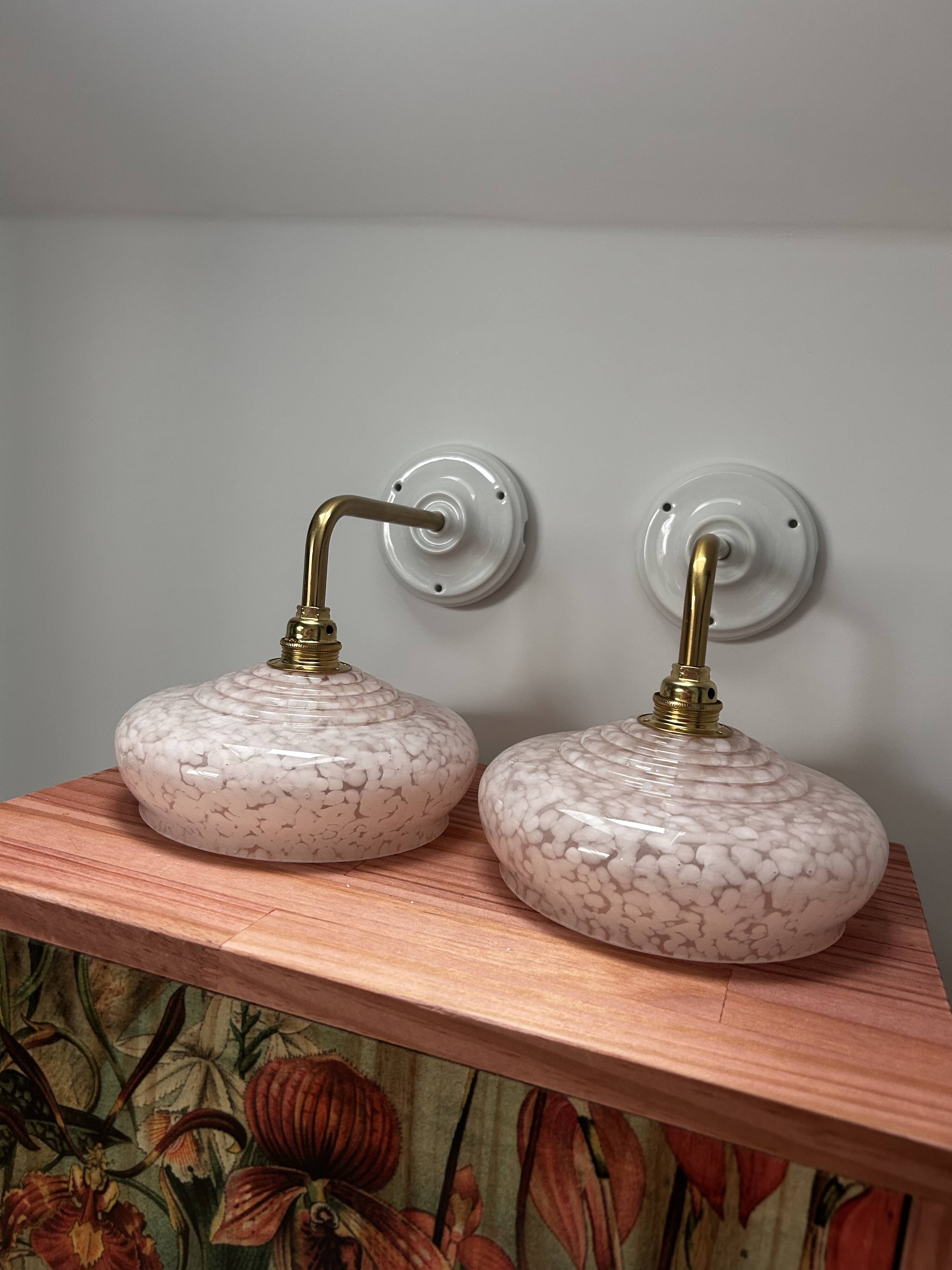 Pair of pink globe wall lights