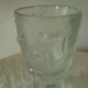 Frosted glass vase with a relief decoration of cherries.