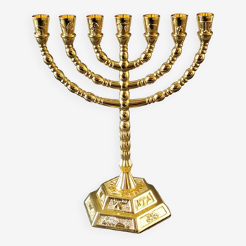 Menorah/Jewish/Hebrew candlestick with 7 arms of light. Engraved with the symbols of the 12 tribes of Israel/Holyland inscription. In gold metal. Size 20 x 16 cm