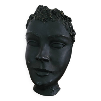 Black ceramic face sculpture
