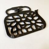 Old enameled cast iron trivet