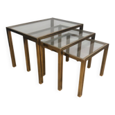 Set of 3 nesting tables in brass and glass. French work by Guy Lef.