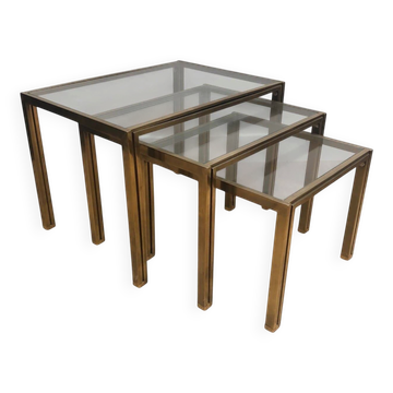 Set of 3 nesting tables in brass and glass. French work by Guy Lef.