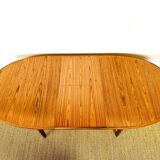 Oval teak dining table with extension