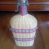 Glass and wicker bottle