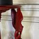 Athenian carved wood, red patina imitation of red marble