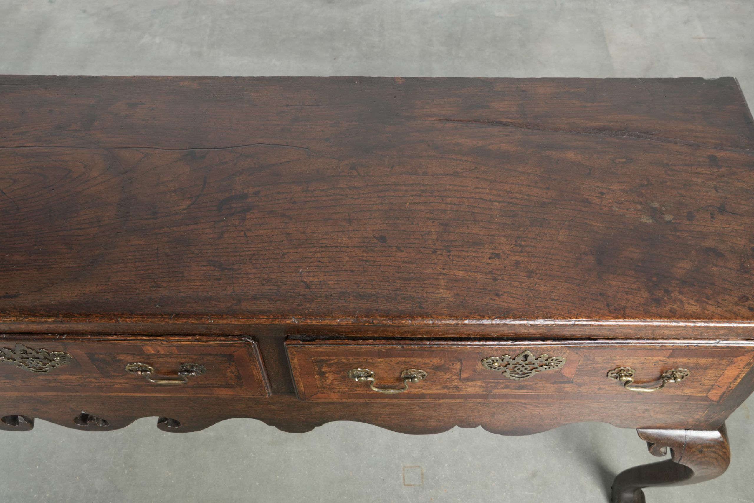 Large antique English oak sideboard from the 18th century with elegant legs