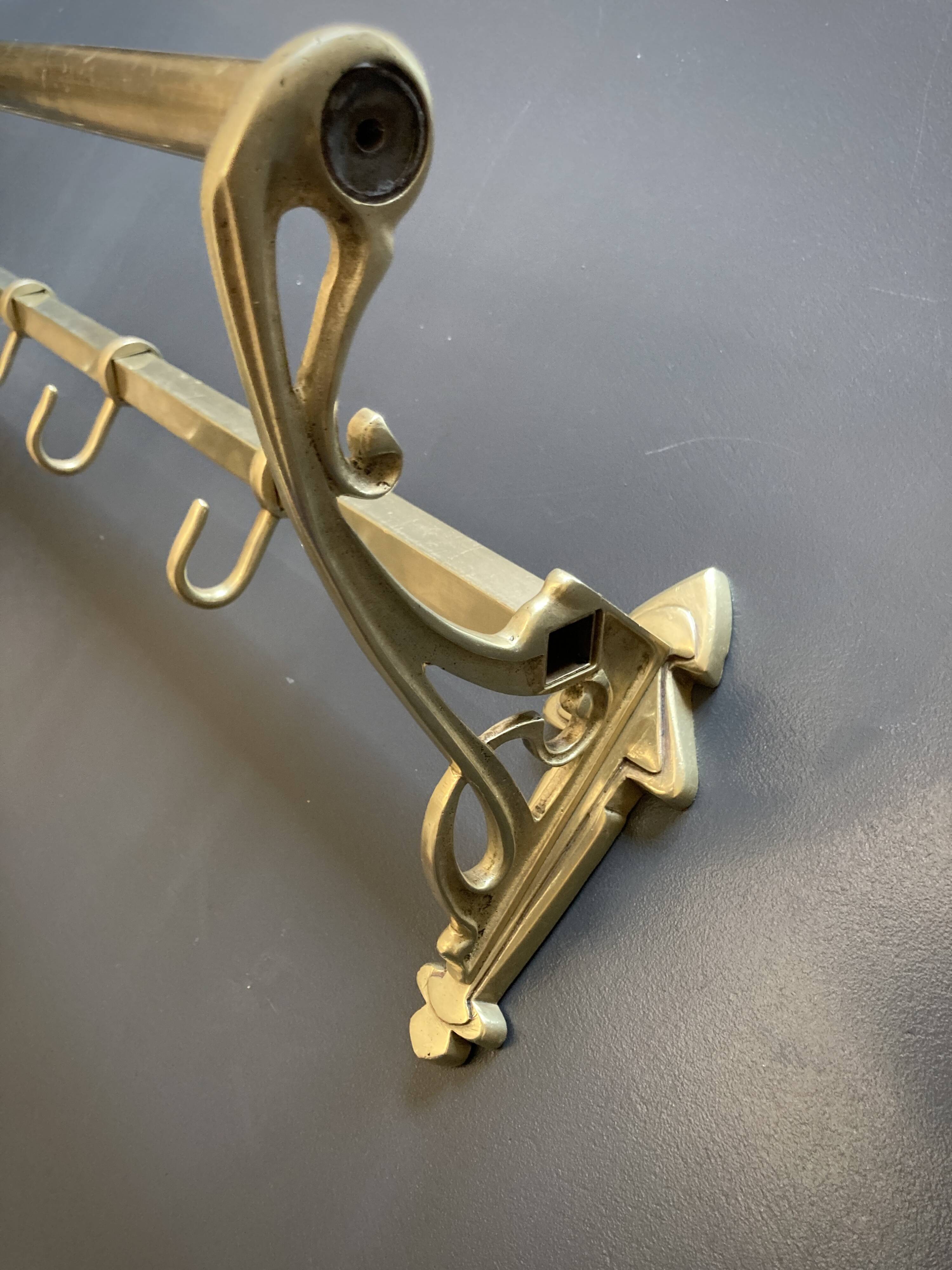 Art-deco wall-mounted coat rack in brass