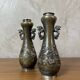 Pair of bronze vases - Asian motifs in relief in copper