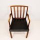 Mid-century armchair by Ole Wanscher for Fritz Hansen, stained beech and leather.