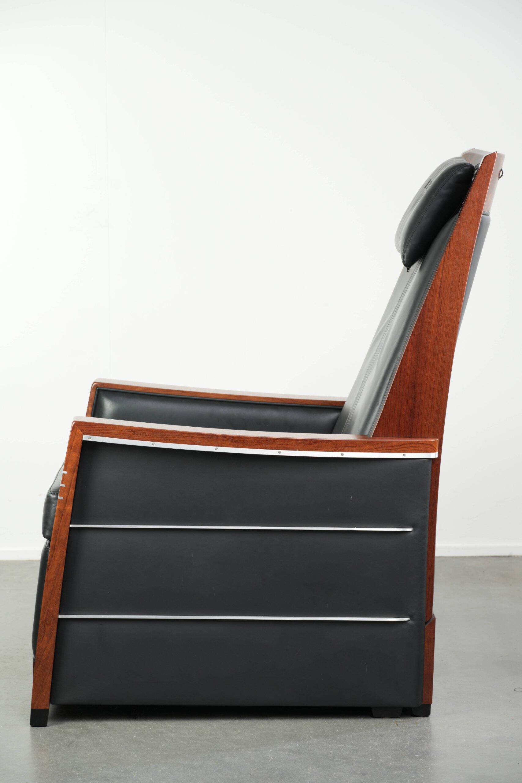 Electrically adjustable Art Deco design recliner with black cowhide leather