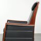 Electrically adjustable Art Deco design recliner with black cowhide leather