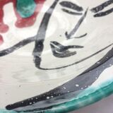 Ceramic plate decorated with a face