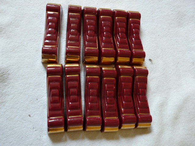 together 12 carries knives and a red enamelled earthenware bottle