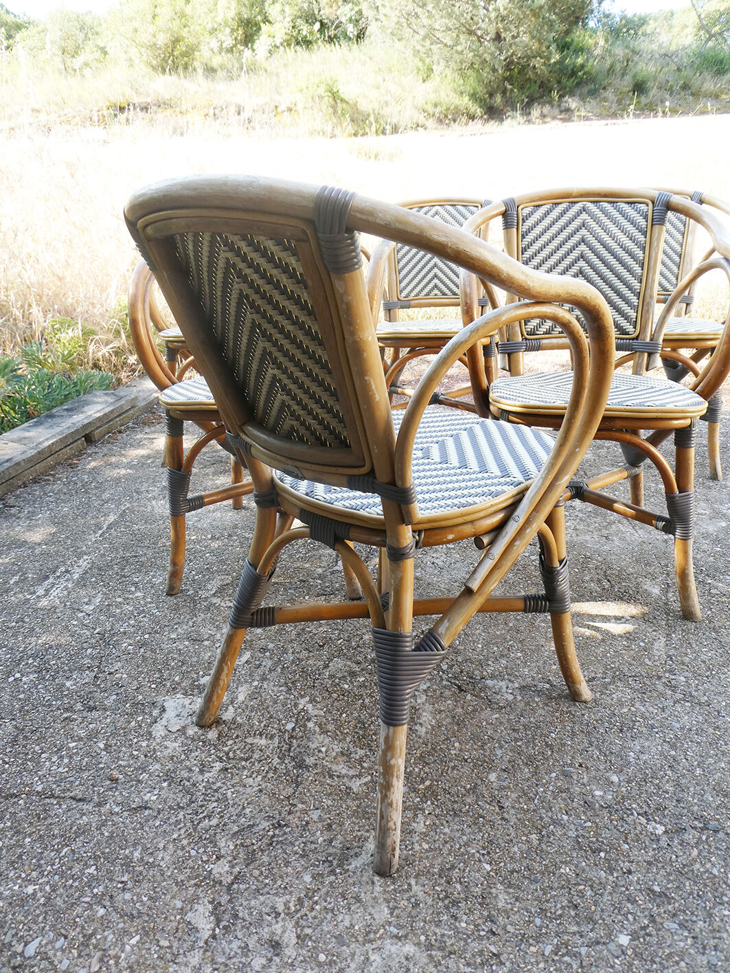 Ensemble de 6 fauteuils bistrot de terrasse en rotin type "parisienne".