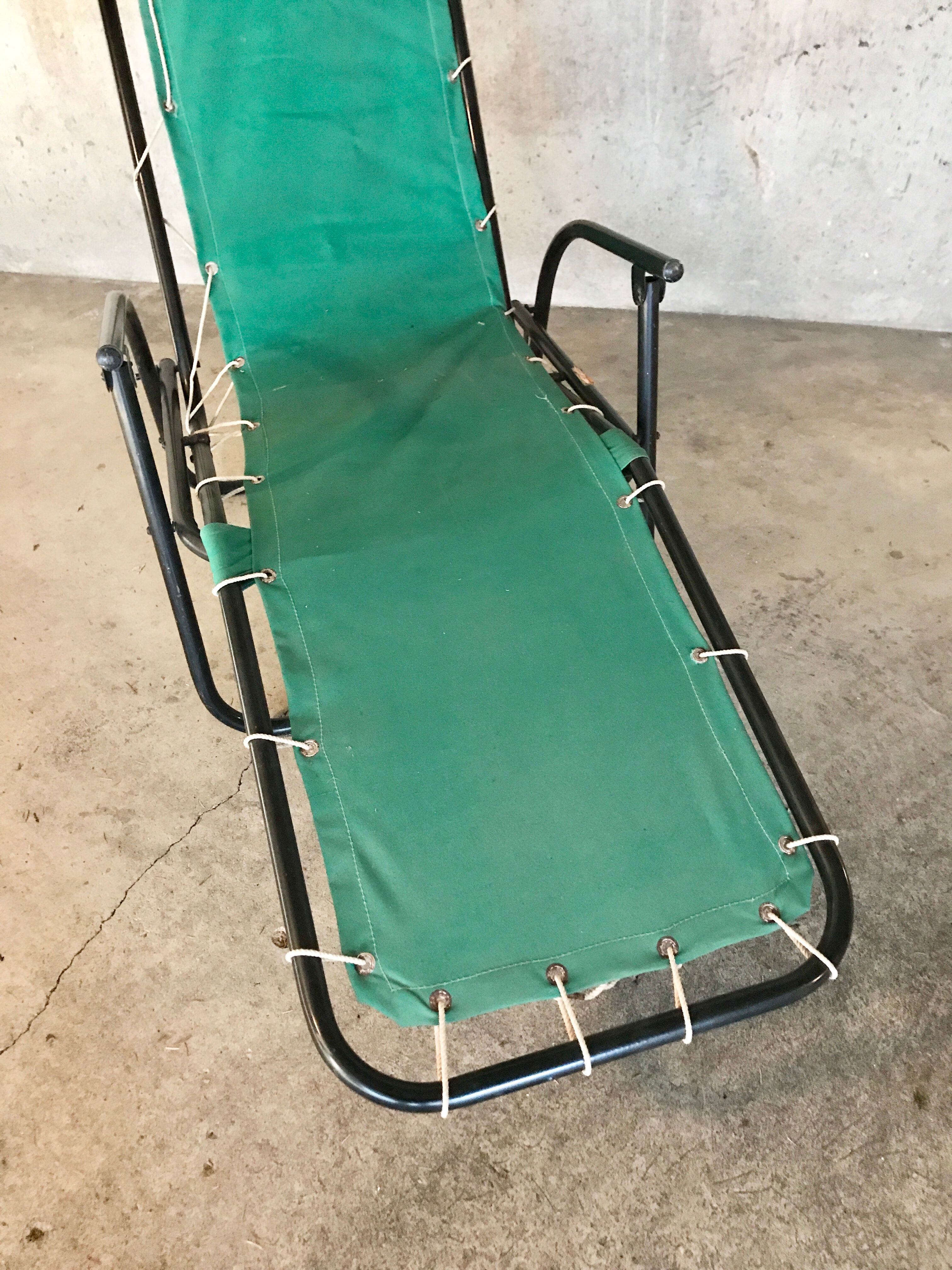 Green fabric and black metal tube long chair