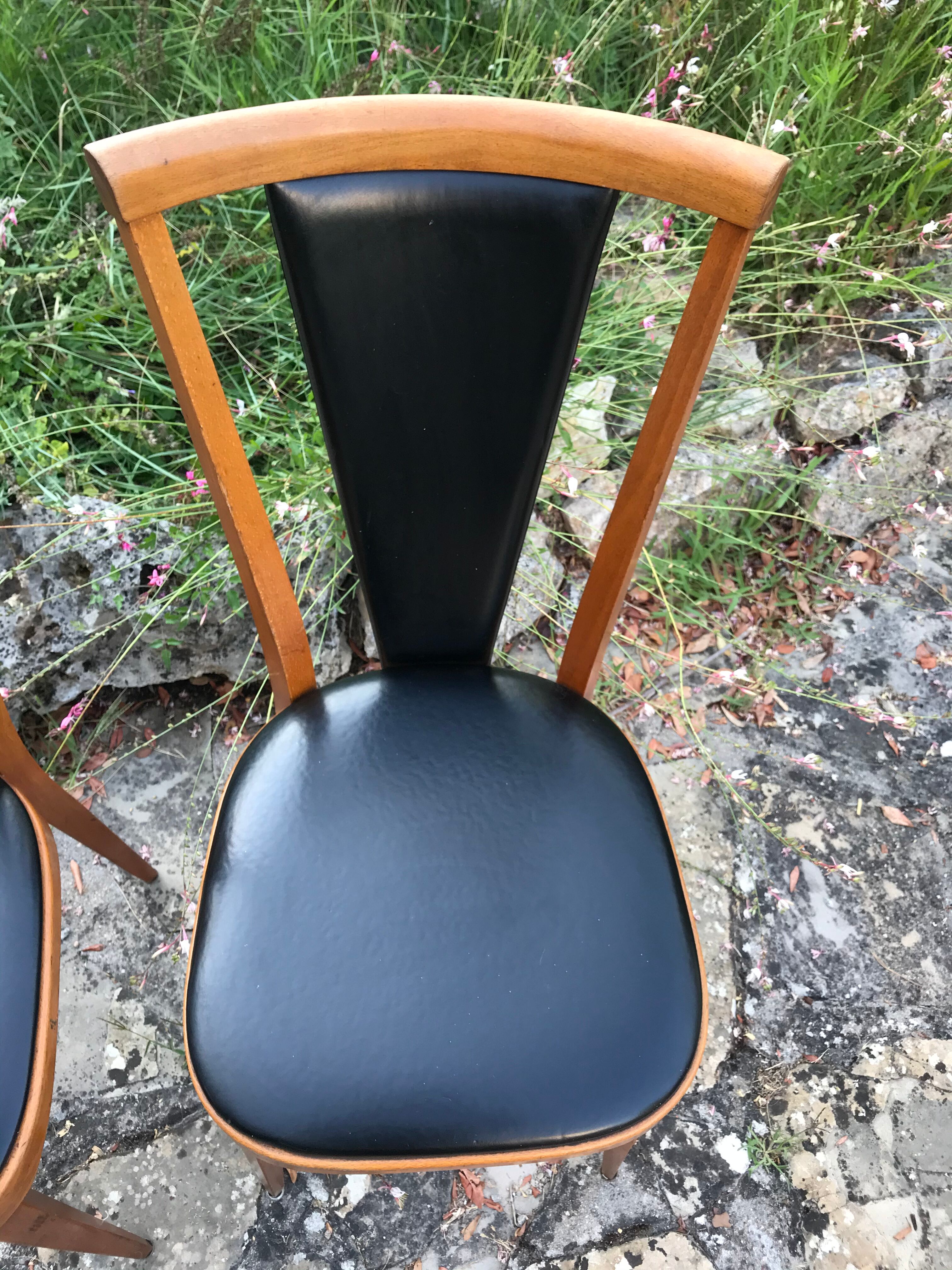 Four vintage beech and skai chairs