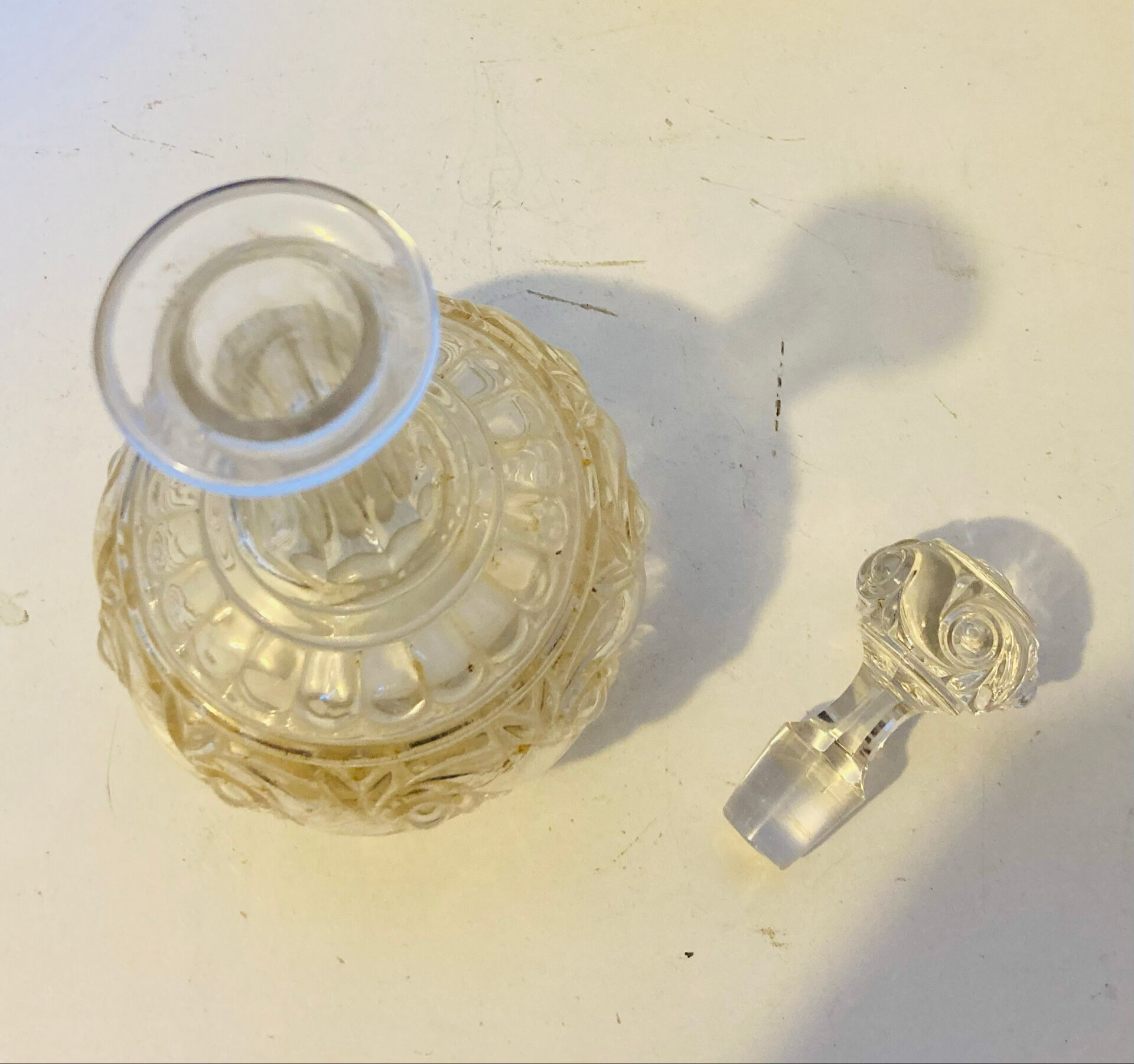19th-century liqueur carafe in glass adorned with relief patterns.