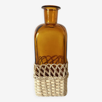 Amber glass and rattan carafe