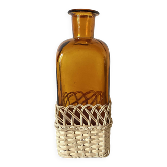 Amber glass and rattan carafe