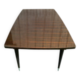 Scandinavian extendable dining table made of solid wood and rosewood effect.