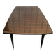 Scandinavian extendable dining table made of solid wood and rosewood effect.
