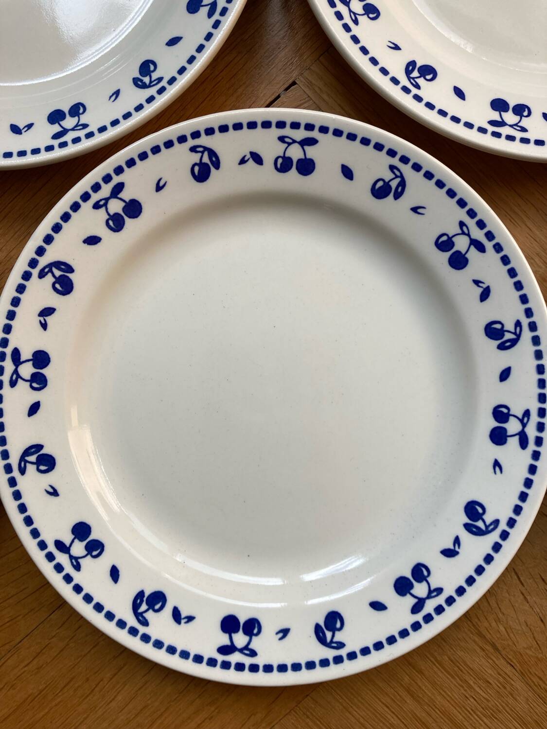 Vintage dessert plates with blue cherry pattern