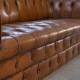 Fawn-colored tufted Chesterfield sofa
