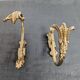Pair of golden metal tiebacks