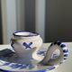 Dutch white and blue candlestick with windmill pattern.
